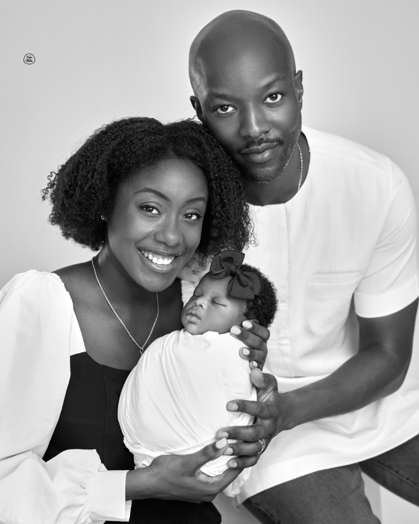Perry and his wife with their newborn baby